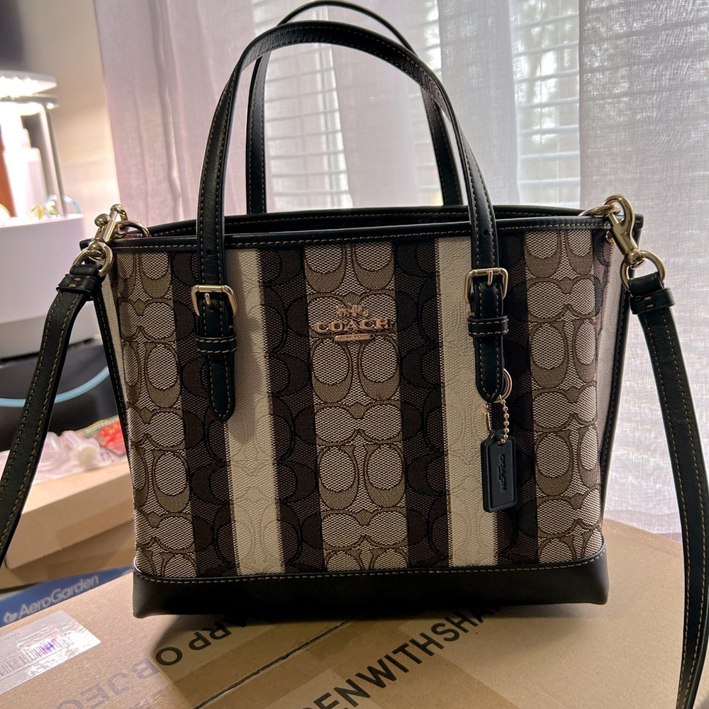NWOT Coach Mollie 25